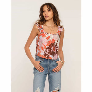 The Sienna Top is a go-to for casual and easy days. It has a relaxed fit and ruffled straps. Pair it with cut-offs for a perfect spring-to-summer look.