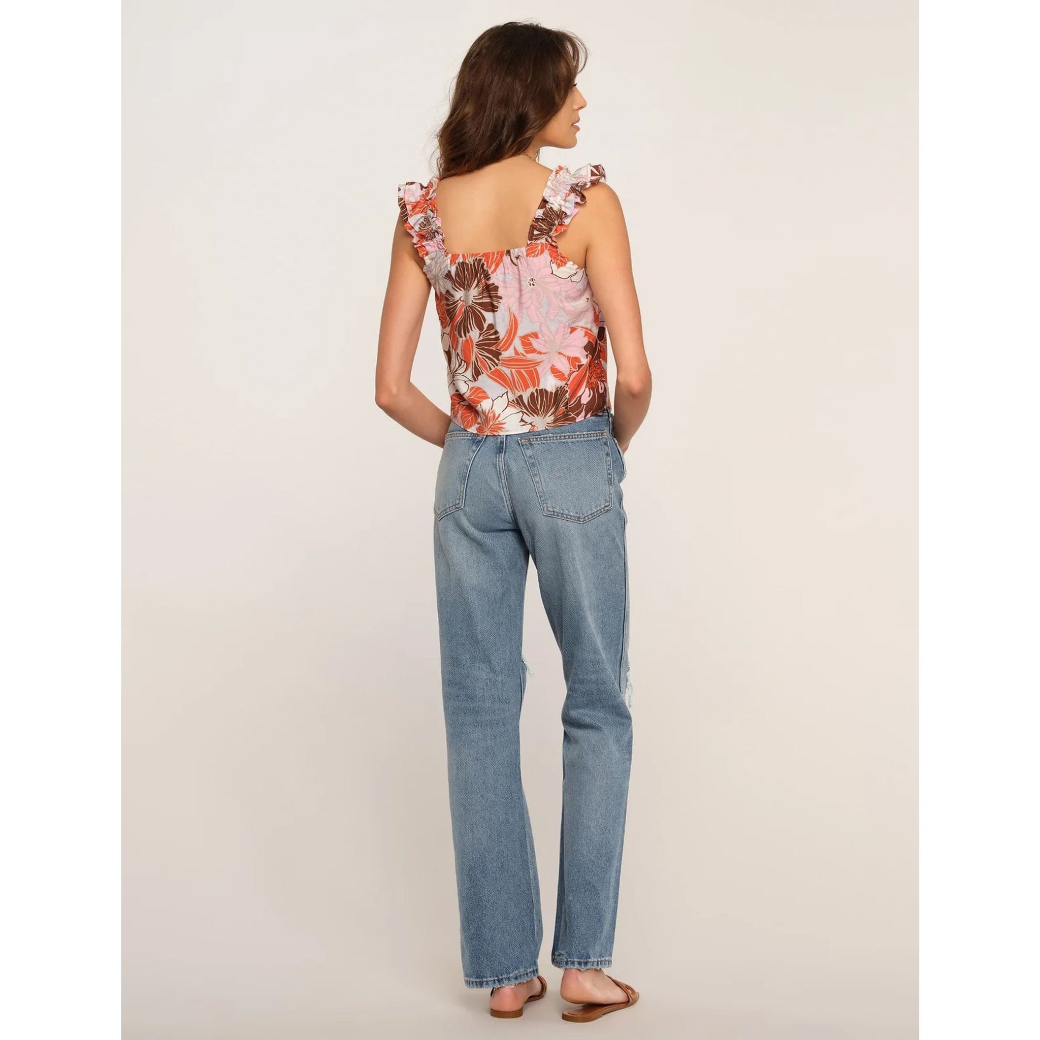 The Sienna Top is a go-to for casual and easy days. It has a relaxed fit and ruffled straps. Pair it with cut-offs for a perfect spring-to-summer look.